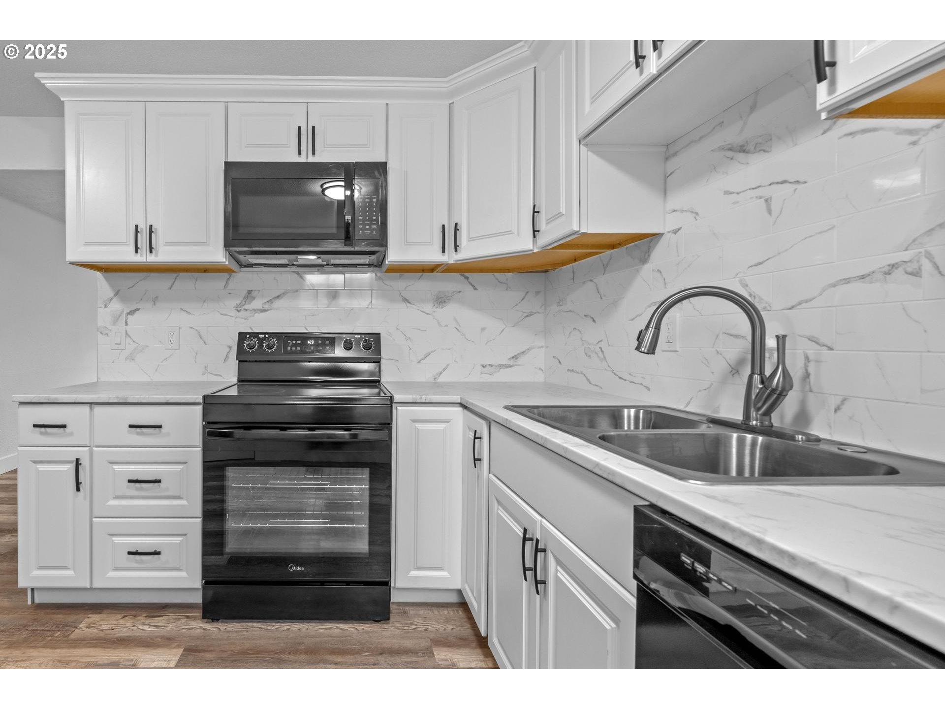 4804-4806 Northeast 111th Avenue Portland, OR 97220 - Photo 24 of 44 a kitchen with appliances a sink and cabinets