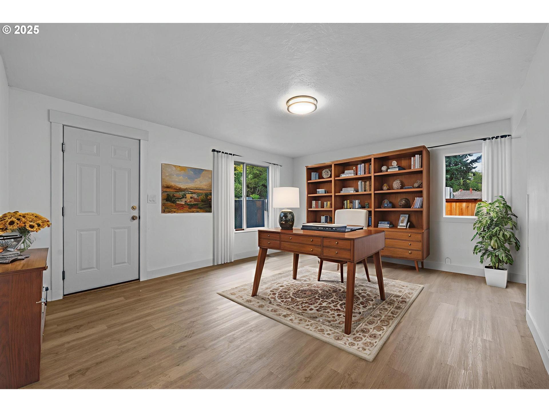 4804-4806 Northeast 111th Avenue Portland, OR 97220 - Photo 4 of 44 a workspace room with furniture and wooden floor