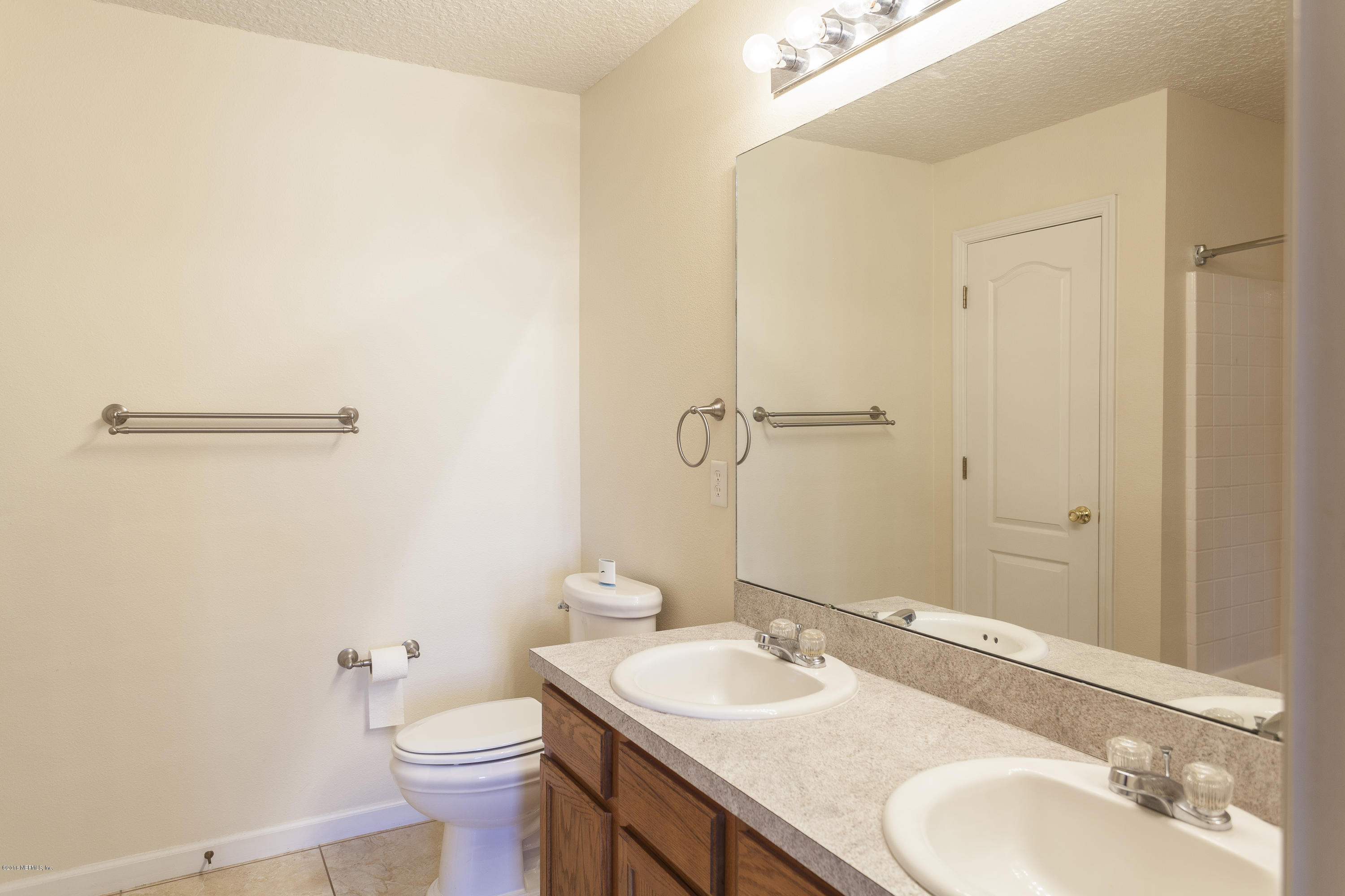 1148 Morning Light Road Jacksonville, FL 32218 - Photo 11 of 28 a bathroom with a sink and a mirror