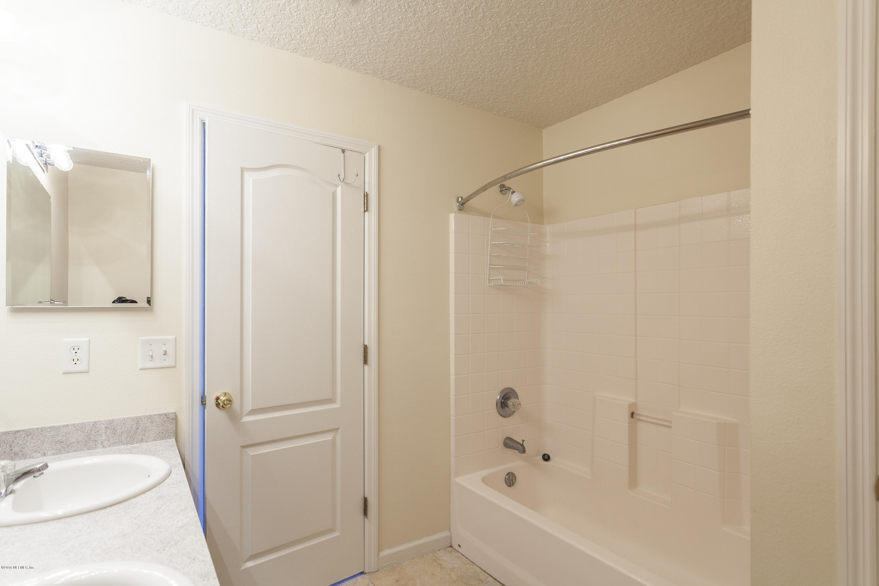 1148 Morning Light Road Jacksonville, FL 32218 - Photo 13 of 28 a bathroom with a bathtub and a shower