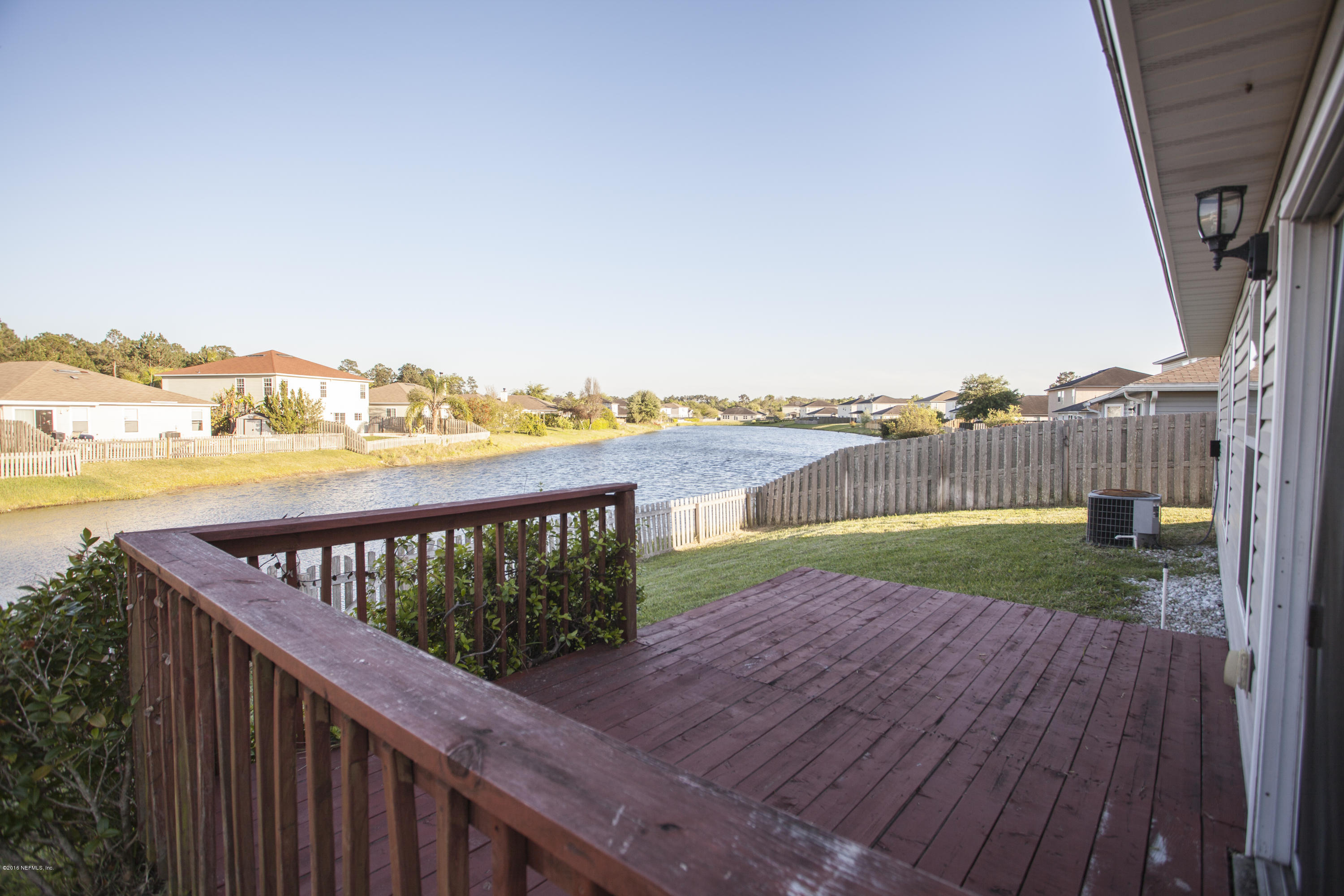 1148 Morning Light Road Jacksonville, FL 32218 - Photo 28 of 28 a view of a balcony with wooden floor and city view