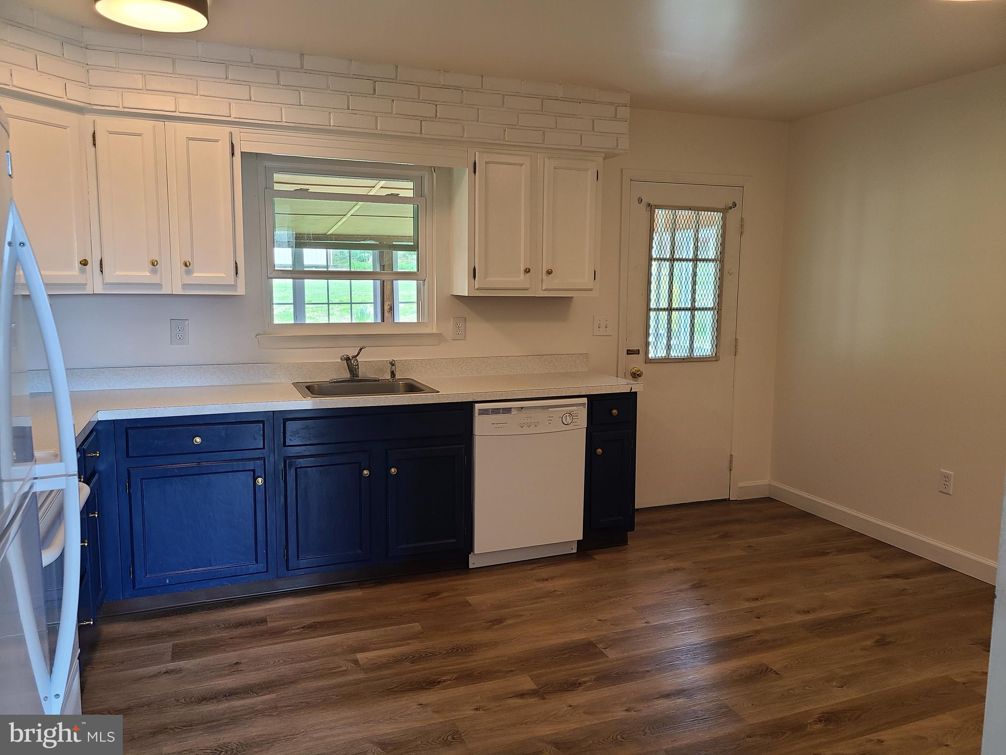 4801 Regal Lane Dunkirk, MD 20754 - Photo 4 of 11 a kitchen with granite countertop wooden cabinets a sink and dishwasher