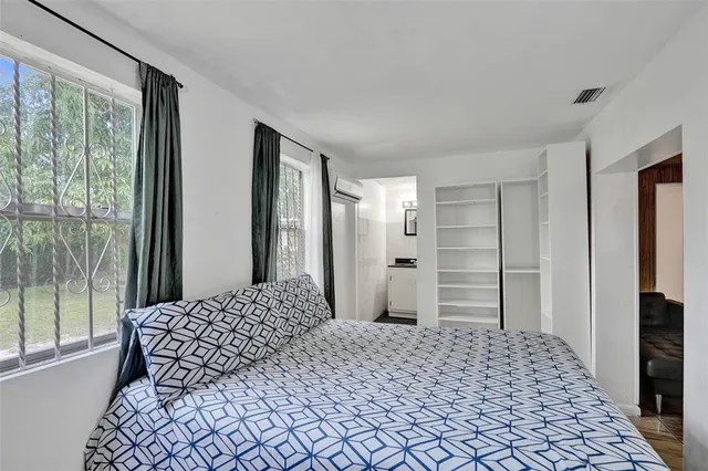 a bathroom with a toilet a sink and a shower