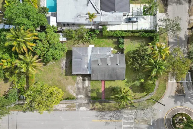 a aerial view of a house with a yard