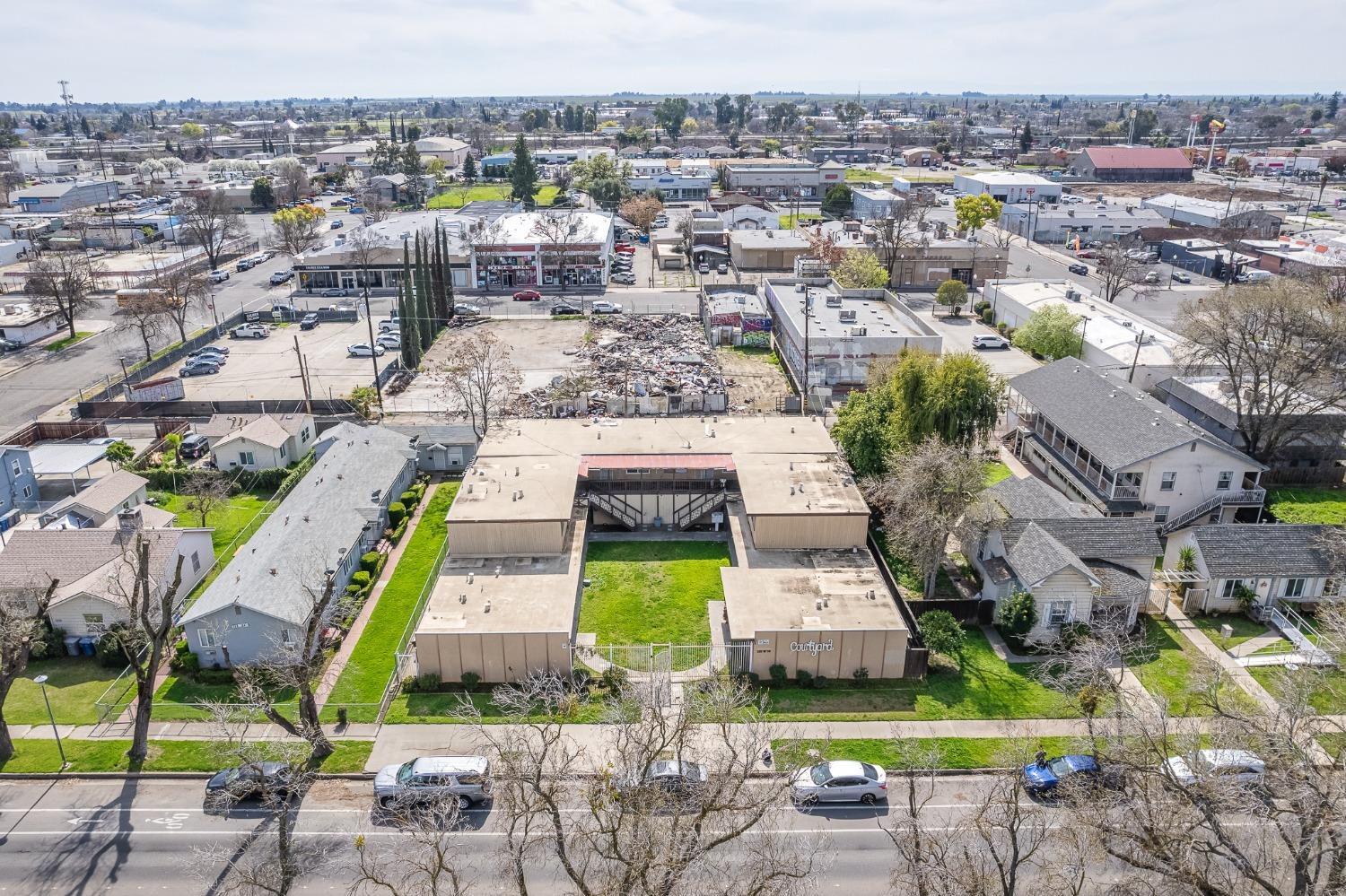 132 West 18th Street Merced, CA 95340 - Photo 18 of 23 an aerial view of a house with a swimming pool