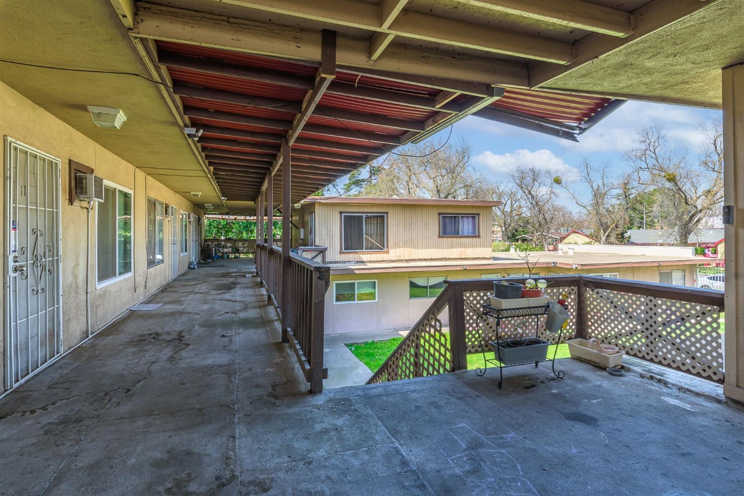 132 West 18th Street Merced, CA 95340 - Photo 8 of 23 a view of a porch with a table and chairs
