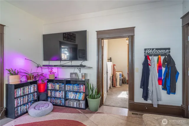 a living room with lots of furniture and a flat screen tv
