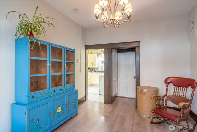 a view of a dining room with furniture and chandelier