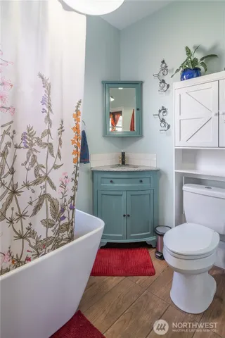 a living room with a couch and a potted plant