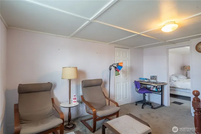 a view of a workspace with furniture and a couch