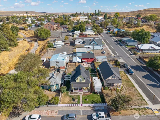 an aerial view of residential houses with outdoor space