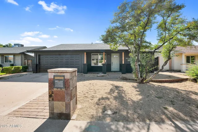 a pathway of a house with a patio
