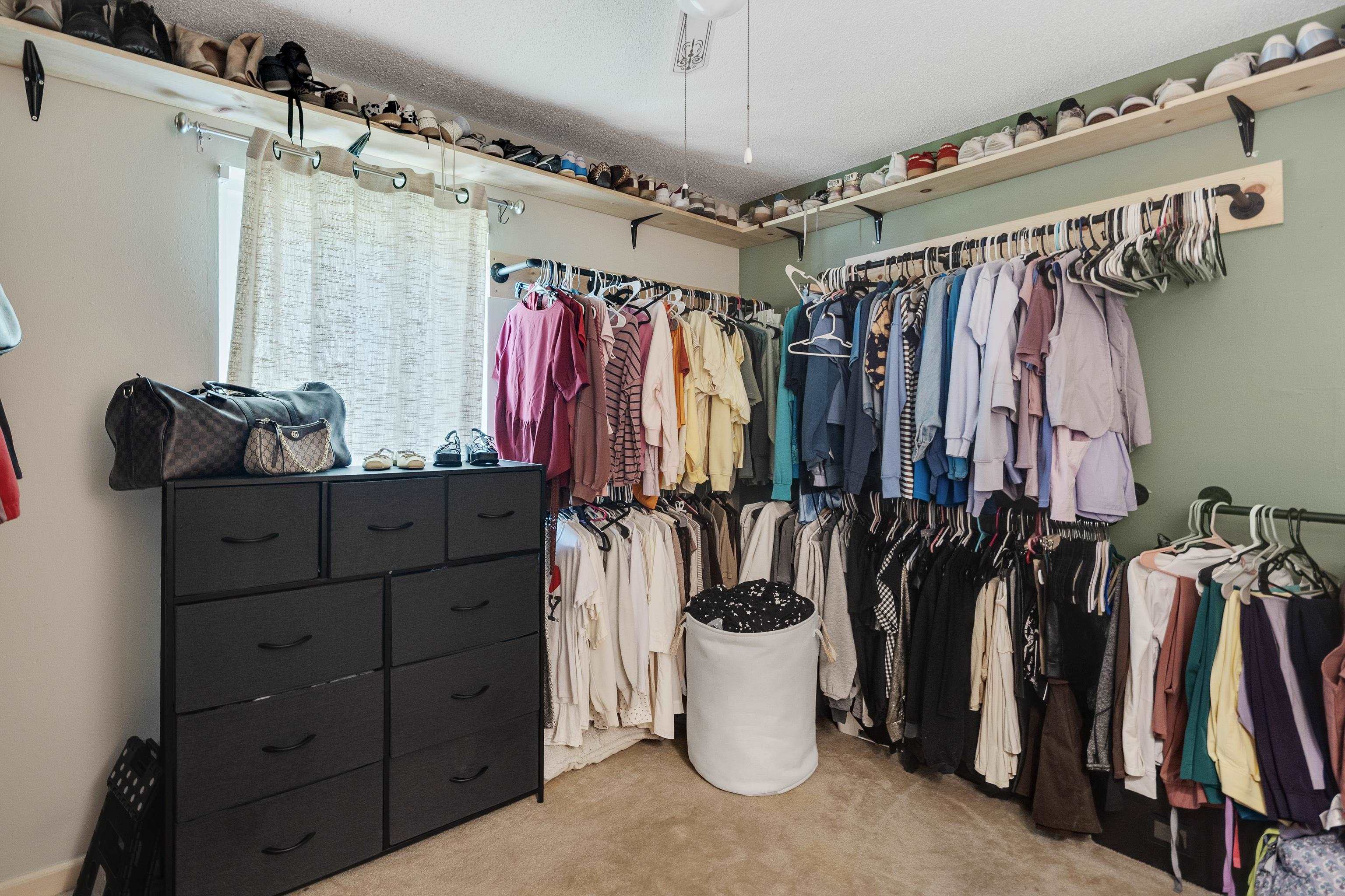 1137 Greenview Road Collierville, TN 38017 - Photo 21 of 35 a view of walk in closet with clothes