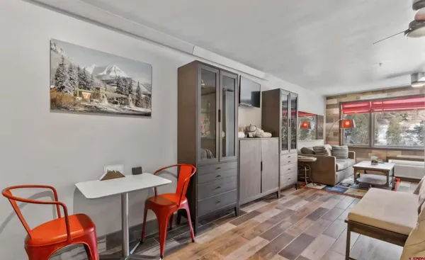 a kitchen with a refrigerator and cabinets
