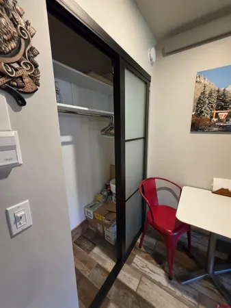 a view of a hallway with seating area