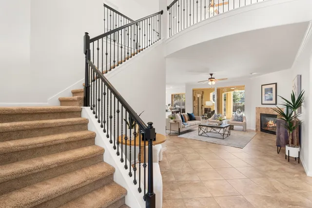 a kitchen with granite countertop sink stove and dining table