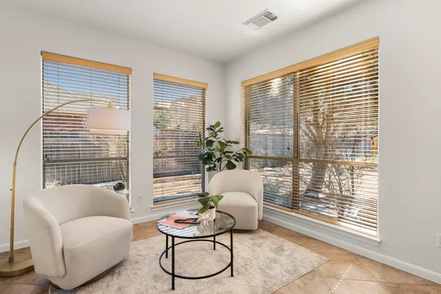 a view of a kitchen with cabinet and a chandelier fan