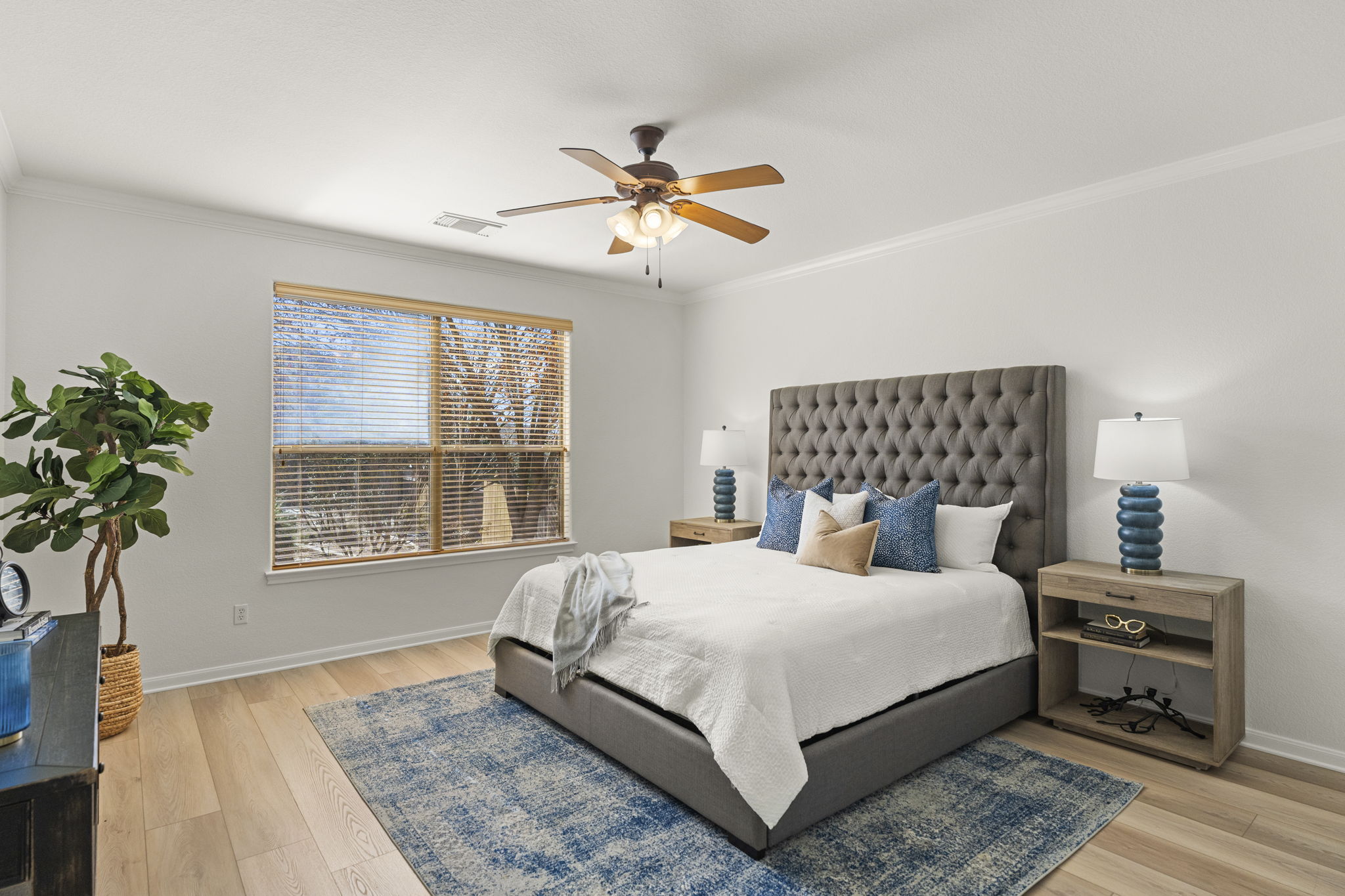 7809 Tusman Drive Austin, TX 78735 - Photo 19 of 38 a bedroom with a large bed and a chandelier