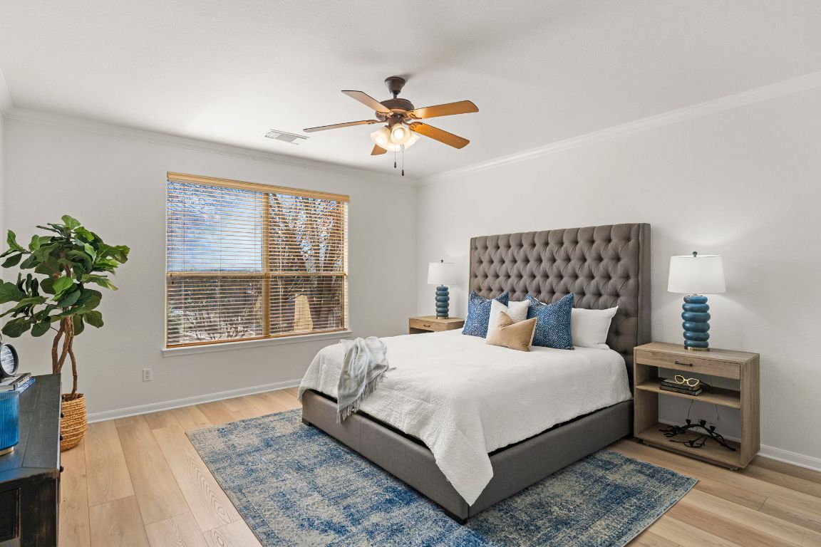 7809 Tusman Drive Austin, TX 78735 - Photo 21 of 40 Primary bedroom with light wood flooring