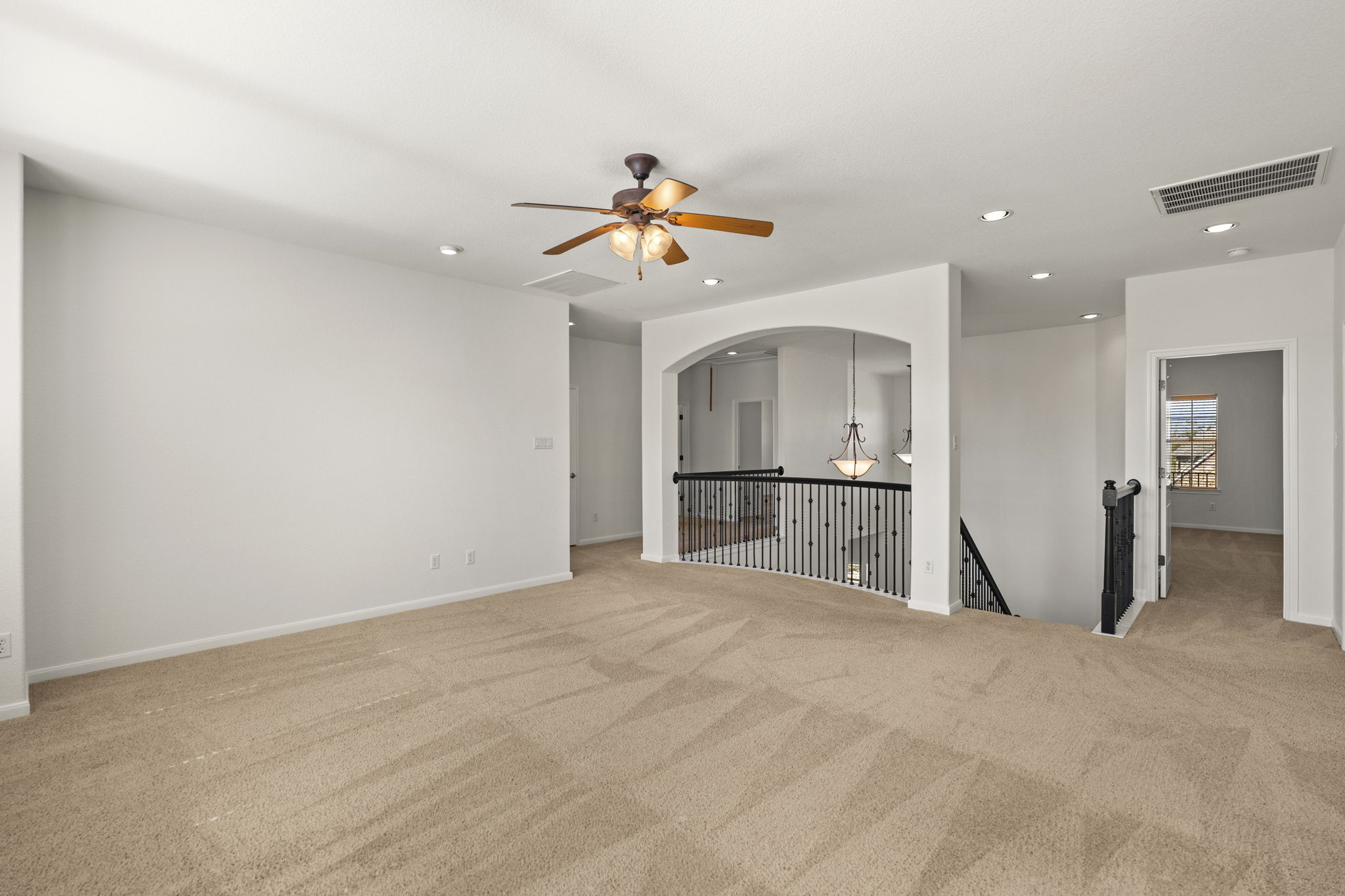7809 Tusman Drive Austin, TX 78735 - Photo 24 of 38 a view of a kitchen with cabinet and a chandelier fan
