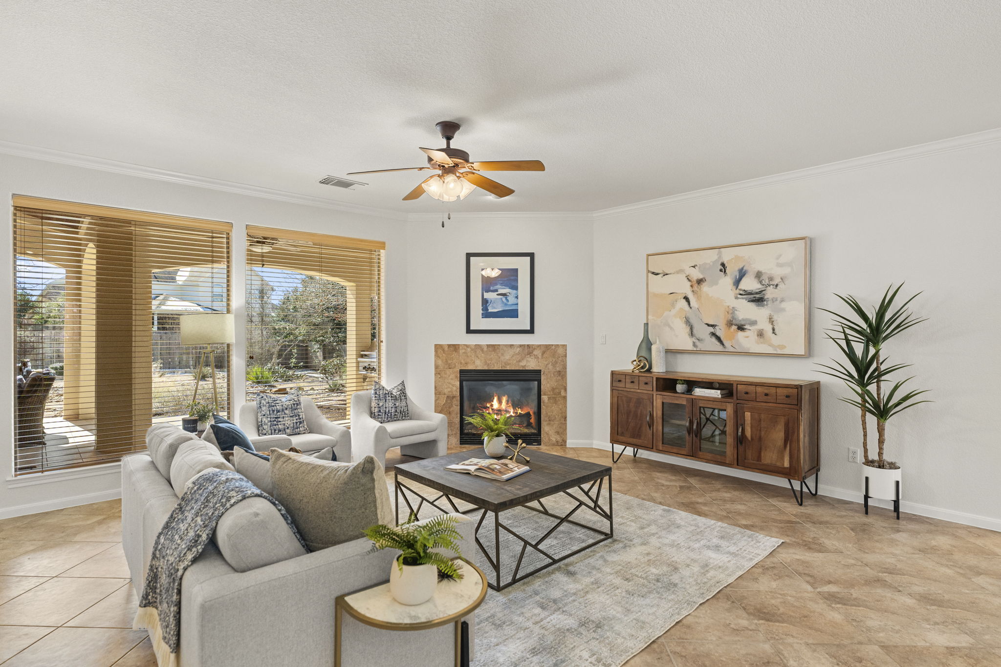 7809 Tusman Drive Austin, TX 78735 - Photo 3 of 38 a living room with furniture a fireplace and a large window with balcony view