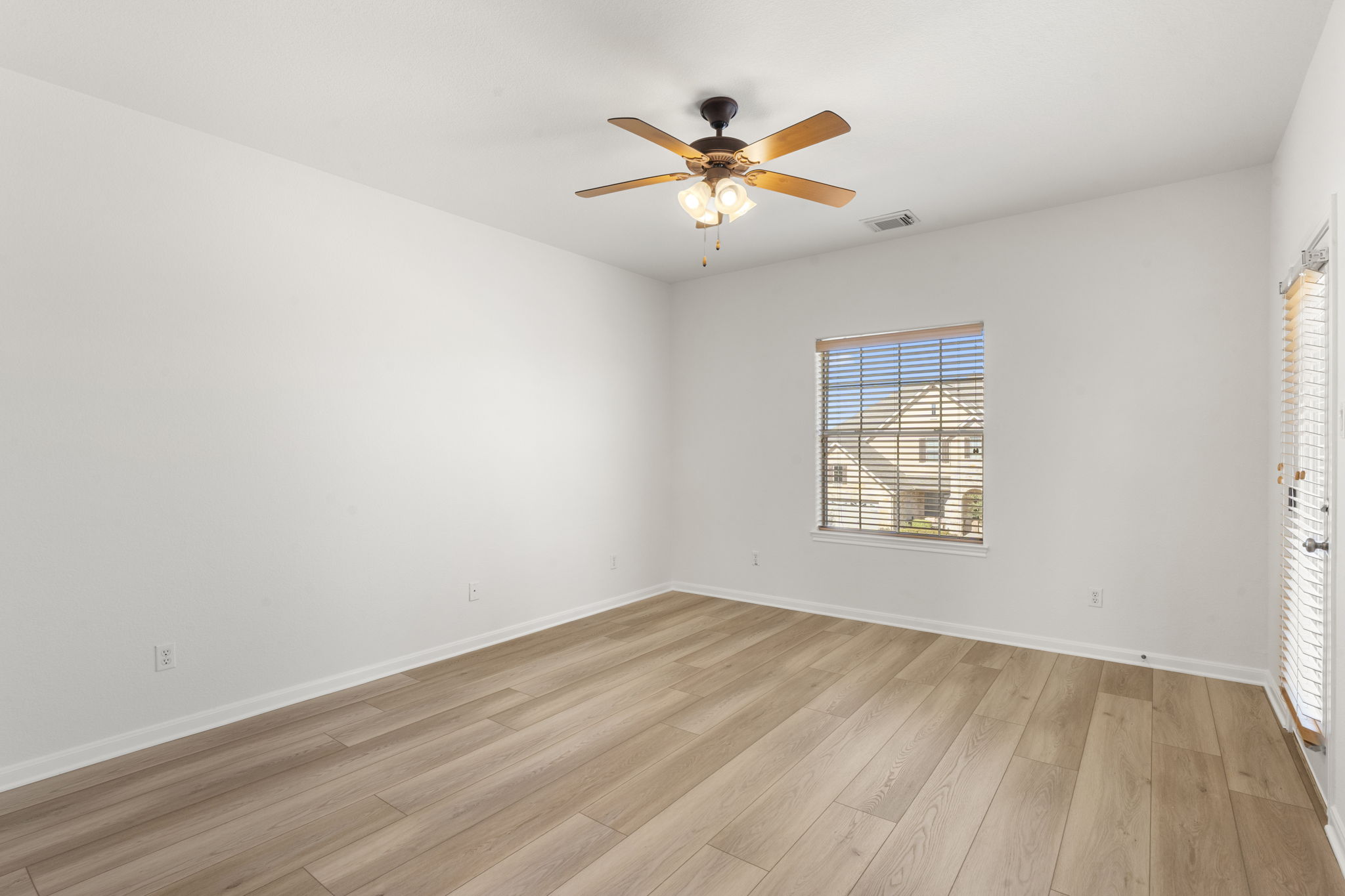 7809 Tusman Drive Austin, TX 78735 - Photo 31 of 38 wooden floor in an empty room with a window