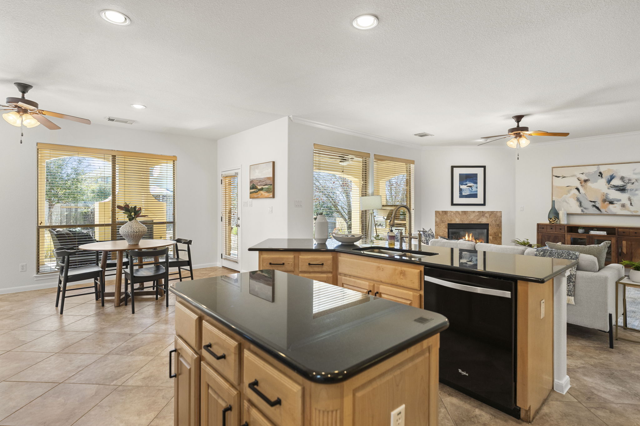7809 Tusman Drive Austin, TX 78735 - Photo 4 of 38 a kitchen with granite countertop sink stove and dining table