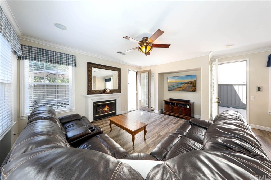 22 Calle Clasico San Clemente, CA 92673 - Photo 11 of 48 a living room with furniture a fireplace and a flat screen tv