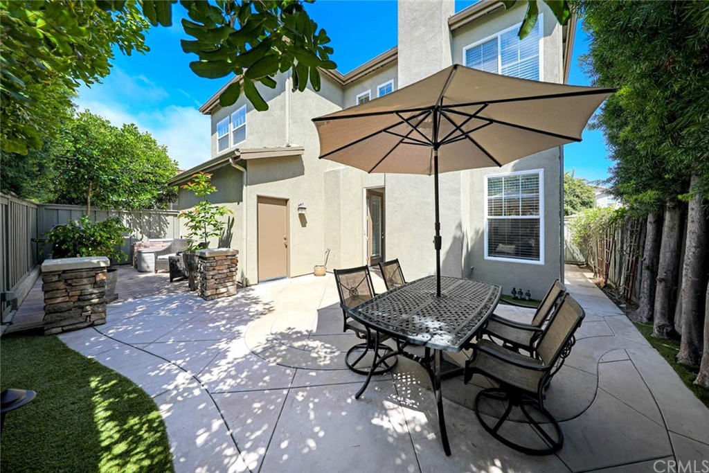 22 Calle Clasico San Clemente, CA 92673 - Photo 30 of 48 a view of a patio with a table and chairs under an umbrella