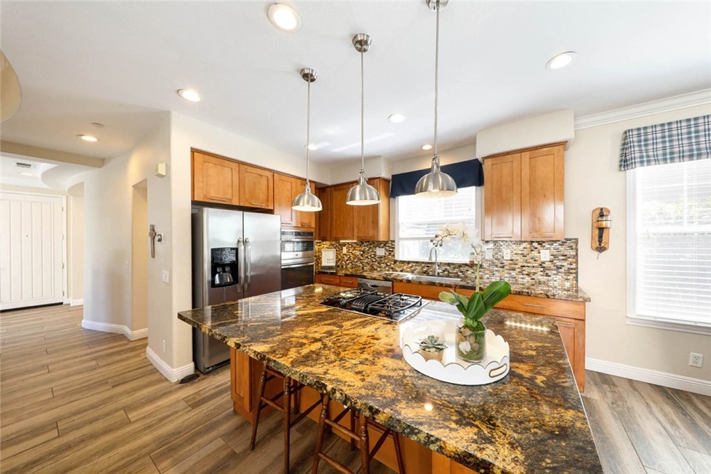 22 Calle Clasico San Clemente, CA 92673 - Photo 9 of 48 a large kitchen with a table and chairs