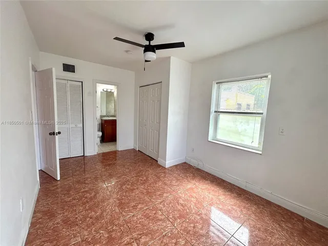 a view of livingroom with window and a ceiling fan