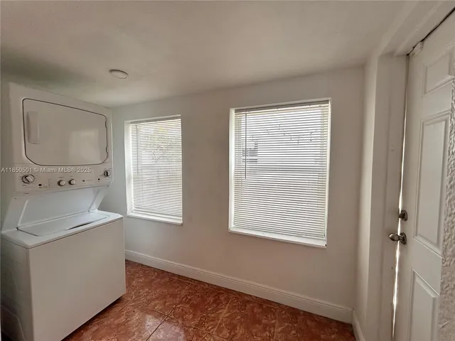 a view of a sink and a window in a room