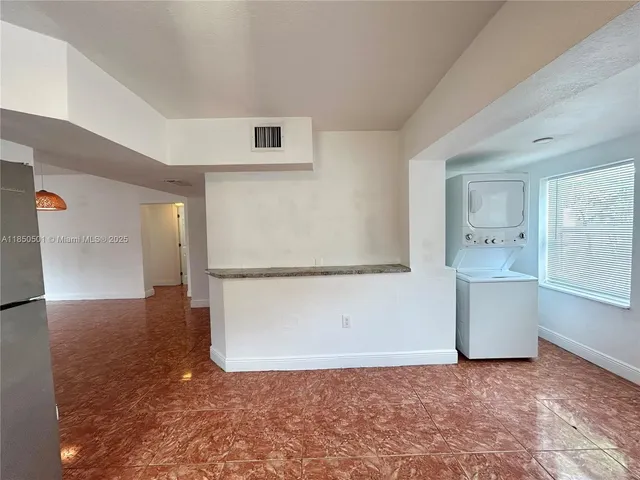 a view of a kitchen with a sink