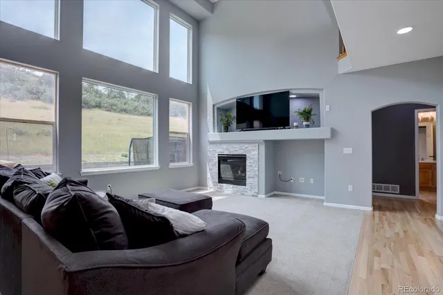 a bathroom with a granite countertop sink toilet a mirror and shower