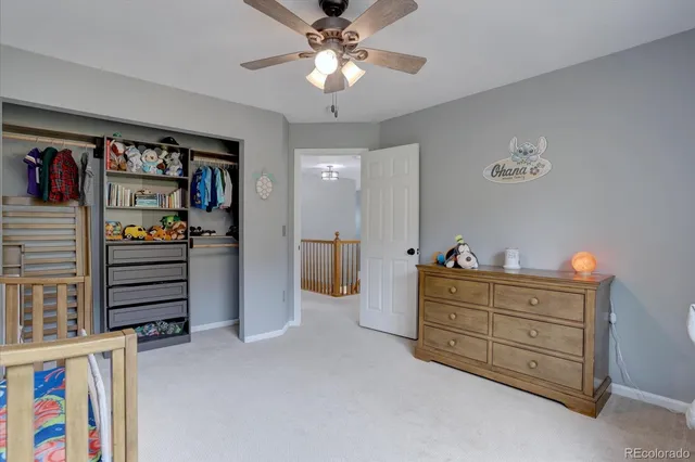a bedroom with a bed and a walk in closet