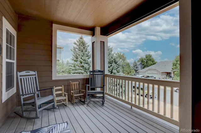 a view of a two chairs in the balcony