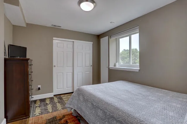 an aerial view of a house with a mountain