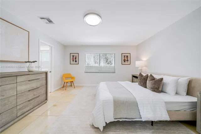 a bedroom with a bed and a cabinets