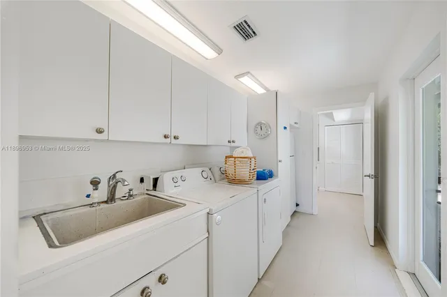 a kitchen with sink cabinets and window