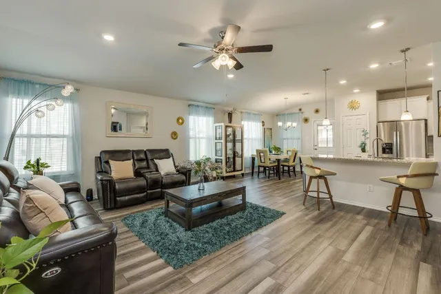 a living room with furniture and a large window