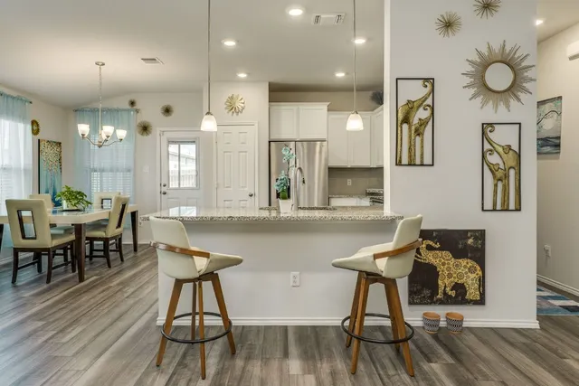 a kitchen with a table and chairs in it