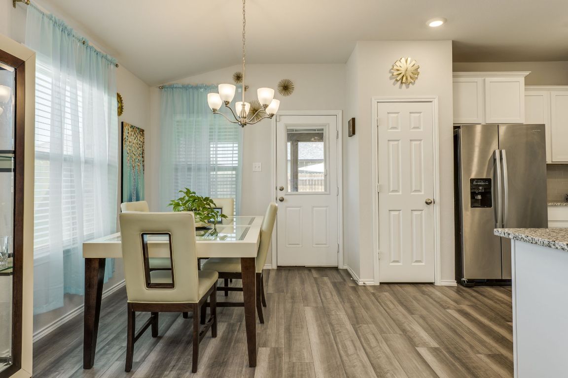 8932 Ranger Smt Road Temple, TX 76502 - Photo 14 of 40 a view of a dining room with furniture and chandelier