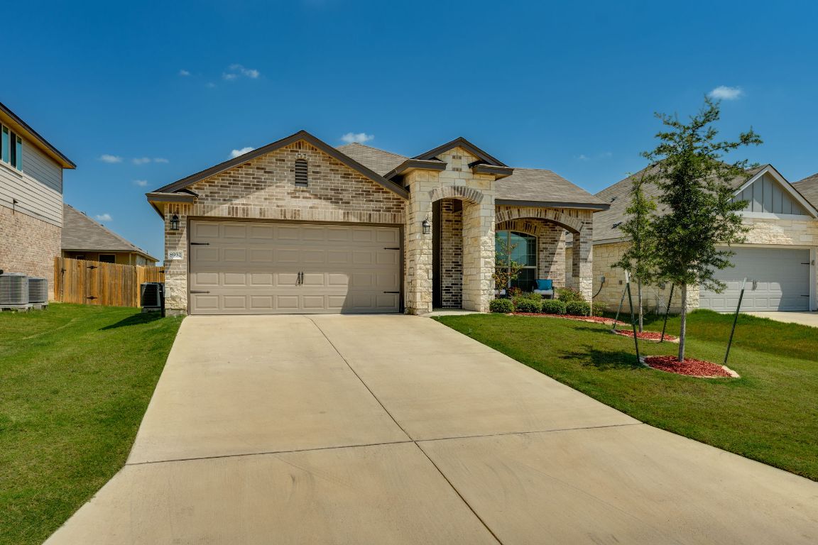 8932 Ranger Smt Road Temple, TX 76502 - Photo 2 of 40 a front view of a house with a yard and garage