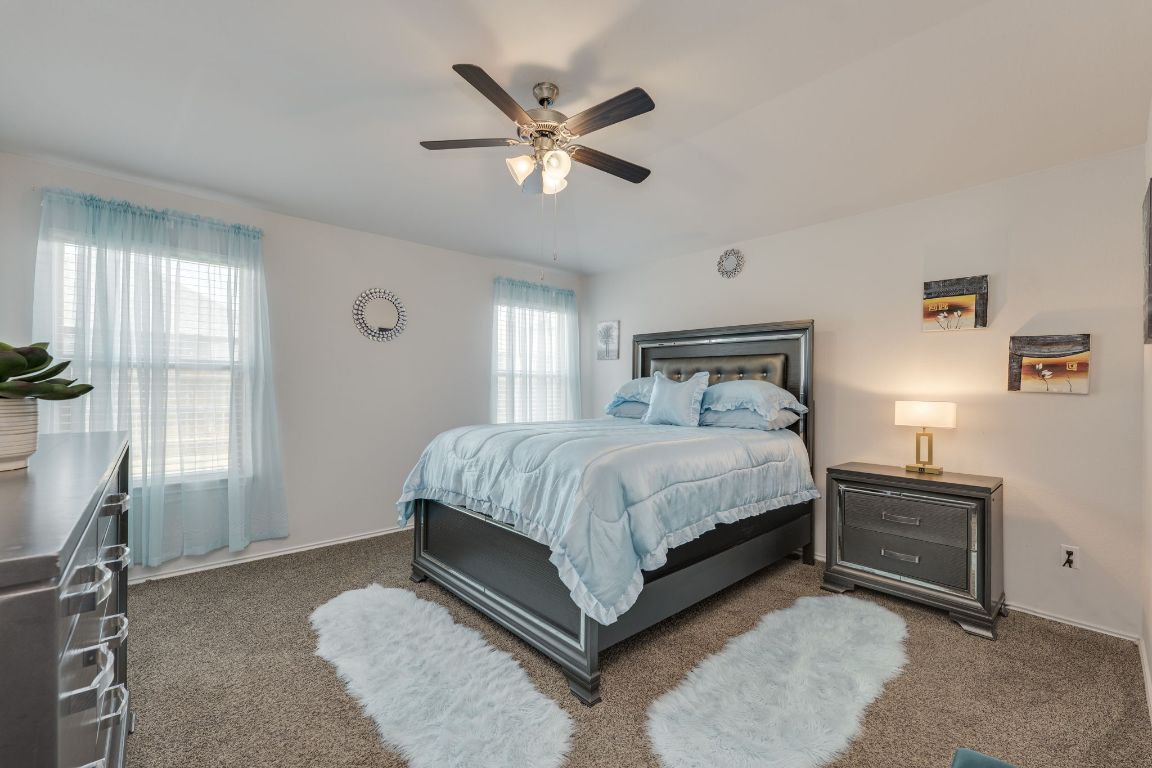 8932 Ranger Smt Road Temple, TX 76502 - Photo 22 of 40 a bedroom with a large bed and windows