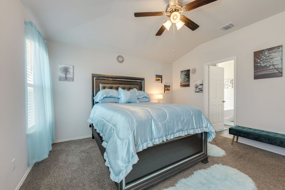 8932 Ranger Smt Road Temple, TX 76502 - Photo 24 of 40 a bed room with a bed and a ceiling fan