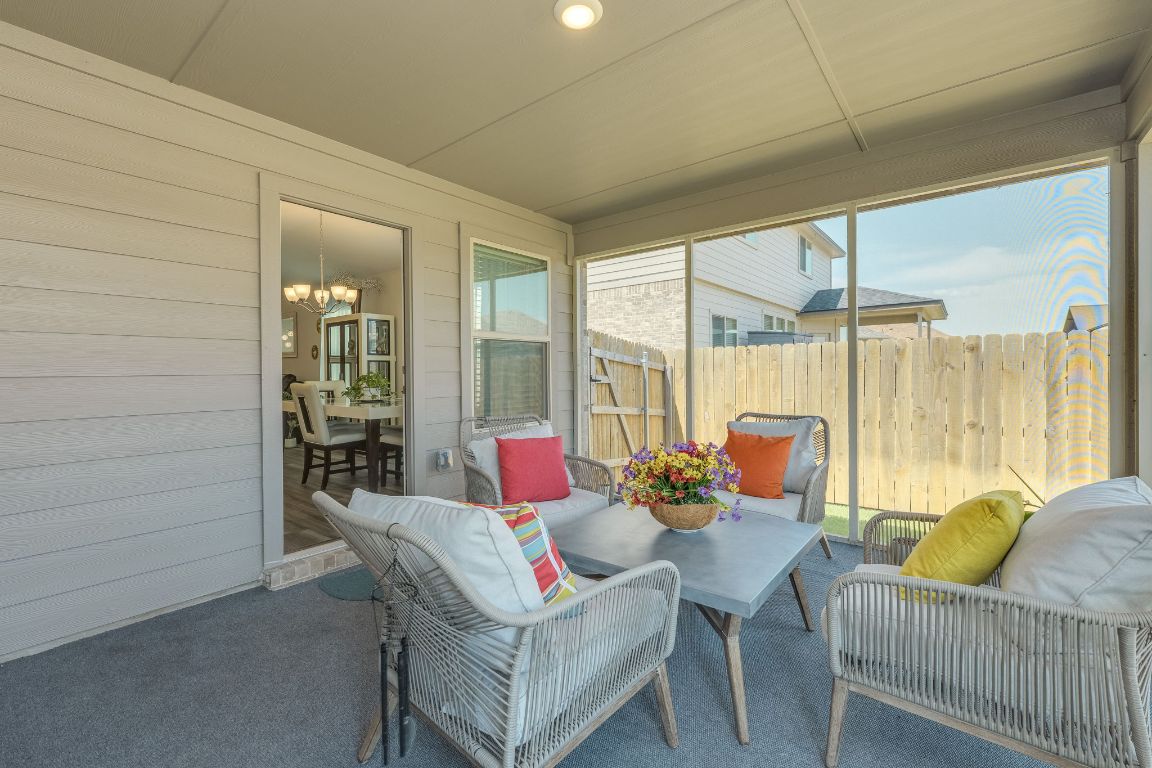 8932 Ranger Smt Road Temple, TX 76502 - Photo 33 of 40 a living room with furniture and a floor to ceiling window