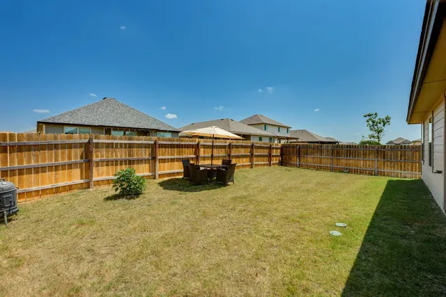 a view of a house with swimming pool and porch