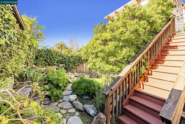 a view of balcony with wooden floor and fence