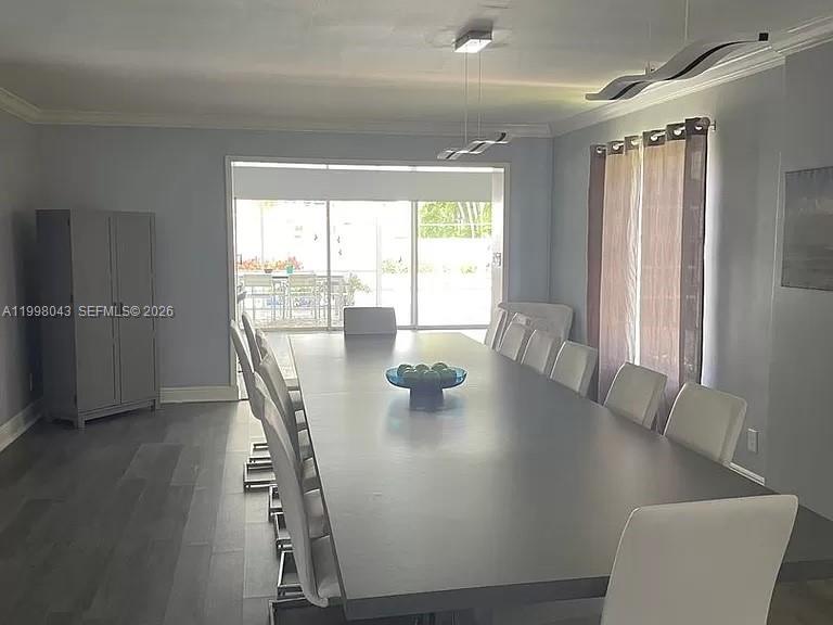 1319 Fillmore Street Hollywood, FL 33019 - Photo 4 of 12 a view of a dining room with furniture and window