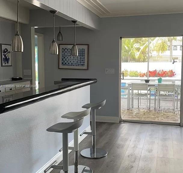 1319 Fillmore Street Hollywood, FL 33019 - Photo 7 of 12 a kitchen with a large window and wooden floor